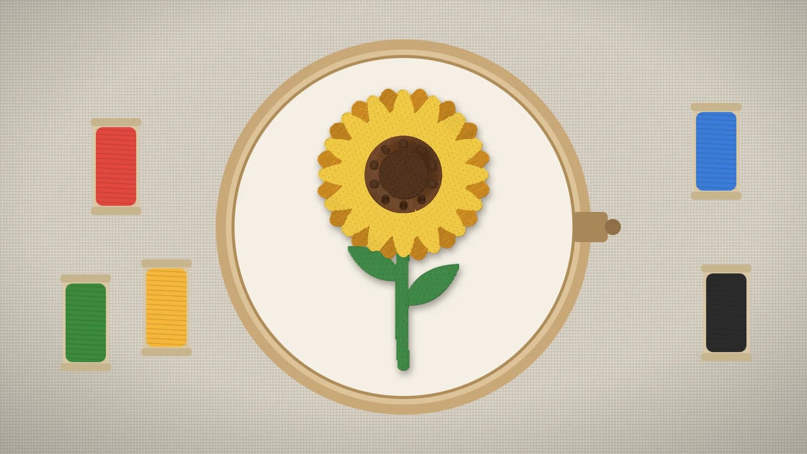 An embroidery hoop holding a stitched sunflower on linen, with spools of thread beside it